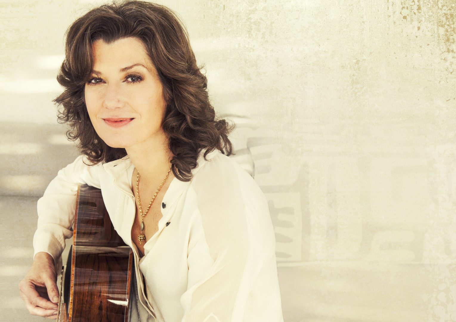 Picture of Amy Grant with her guitar used in an article for an upcoming Franklin TN event