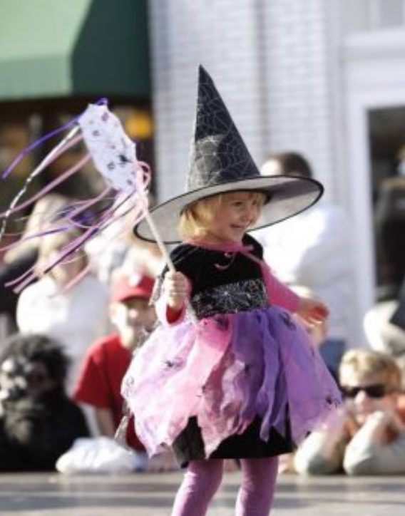 Child at PumpkinFest in Franklin, TN, a festival in downtown Franklin with kids activities, live entertainment, family activities, shopping, fall food and drink, live music, costume contests for pets and family and more!