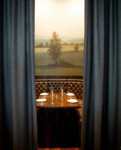 1799 Kitchen and Cocktails restaurant in downtown Franklin, TN offers private dining options for all occasions, and their booths with curtains are unique!
