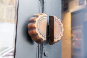 Doorknob to enter Goo Goo Chocolate Co in downtown Nashville, the location offers Design Your Own Confection Stations, a new Chocolate Bar menu including boozy milkshakes, interactive classes, and more!