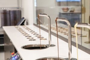 Goo Goo Chocolate Co interior, the downtown Nashville, Tenn location offers Design Your Own Confection Stations, a new Chocolate Bar menu including boozy milkshakes, interactive classes, and more!