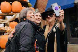 A group at PumpkinFest, a festival in Downtown Franklin TN. kids activities, live music, fall food and drink, costume contest for pets and families, and outstanding arts and crafts featuring seasonal and specialty gift items.