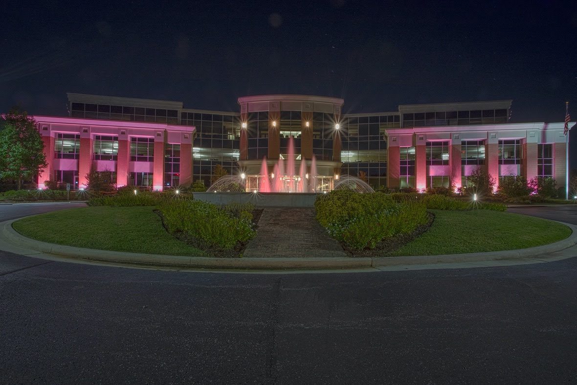 Ascend headquarters building in Tullahoma lit up with pink lights to support the fight against this disease.