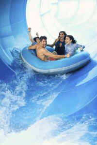 Family tubing at SoundWaves, family activities in Nashville TN, an 84-degree indoor oasis of 110,000 square-feet that allows guests to soak in the sun during the winter, surf on Nashville’s only FlowRider®, take a plunge off of a suspenseful waterslide, zip through the currents of a rpid river and more, additionally, the water attraction features an arcade with virtual relaity games, a rock climbing wall, game tables and more.