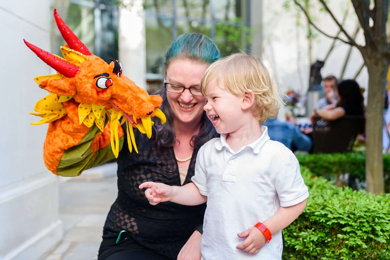 Child and women with a puppet at the Picnic at the Library event in Nashville, TN.