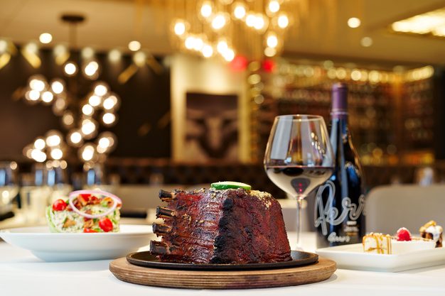 Perry’s Steakhouse & Grille restaurant in Franklin, Cool Springs, three-course Famous Pork Chop with Perry's Pinot Noir.