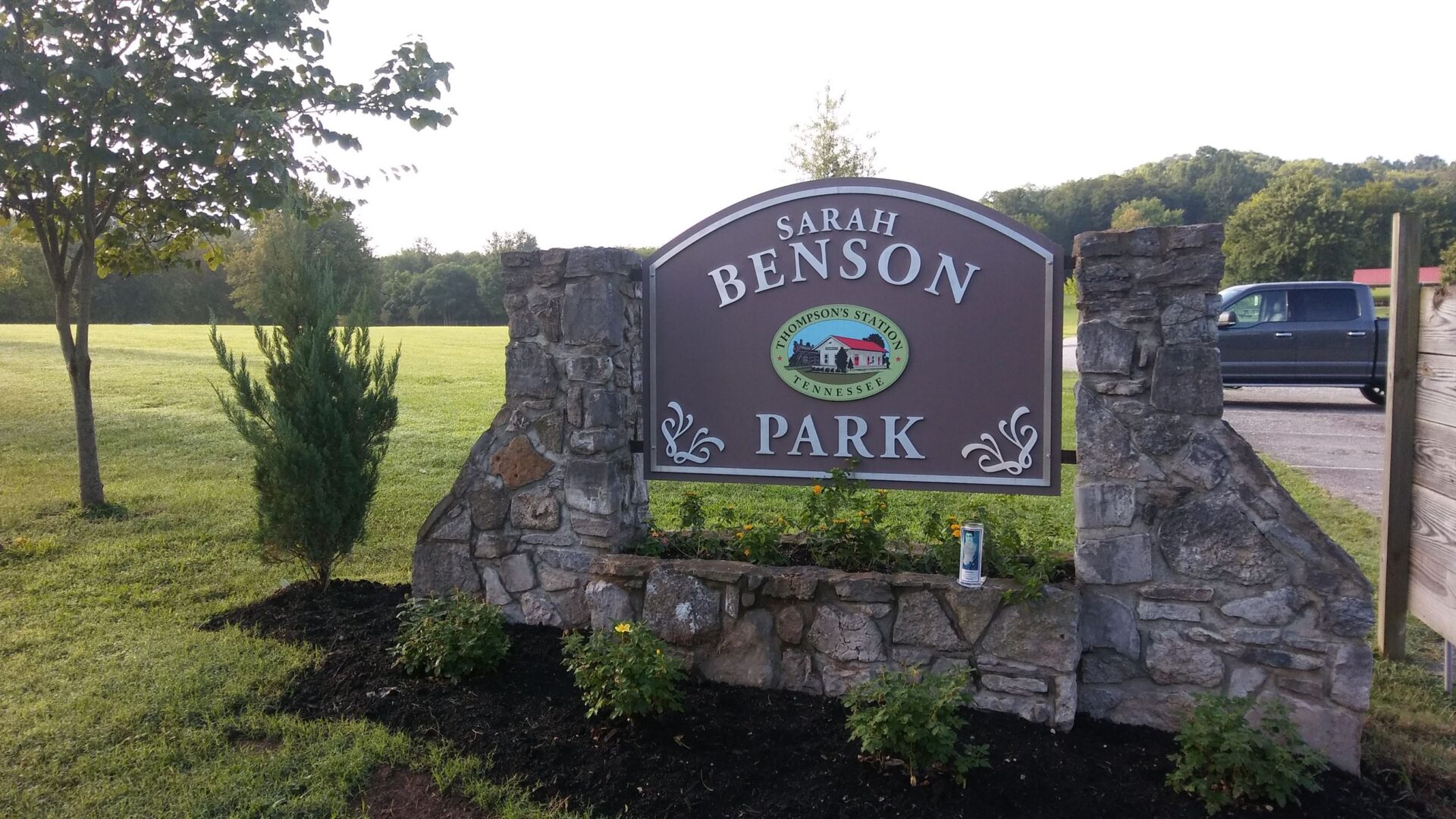 Sarah Benson Park sign, each year Sarah Benson Park hosts events and festivals that bring the community together in celebration of the seasons and is a landmark to the community.