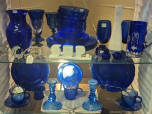 Antique store in Williamson County, Tennessee has antiques displayed on a shelf.