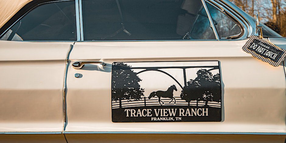 Car door sign at Ranch Round at Trace View Ranch in Franklin, TN, a night of country music and fun at Trace View Ranch! Experience an authentic Nashville style writers round with performances by Wil Nance, Josiah Siska, Andrew Bloom, Tiera Kennedy, Charly Reynolds, and Nicole Croteau.
