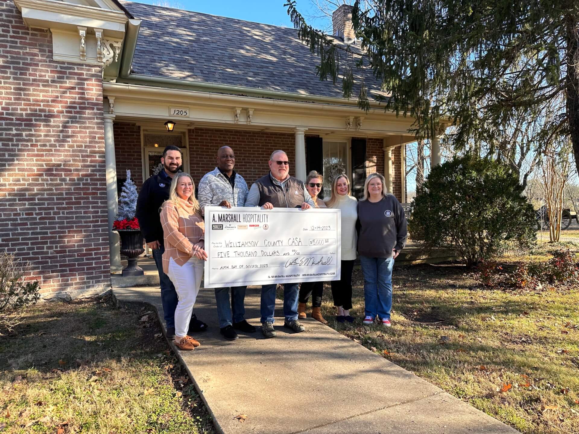 A. Marshall Hospitality presents Williamson County CASA with a donation 2