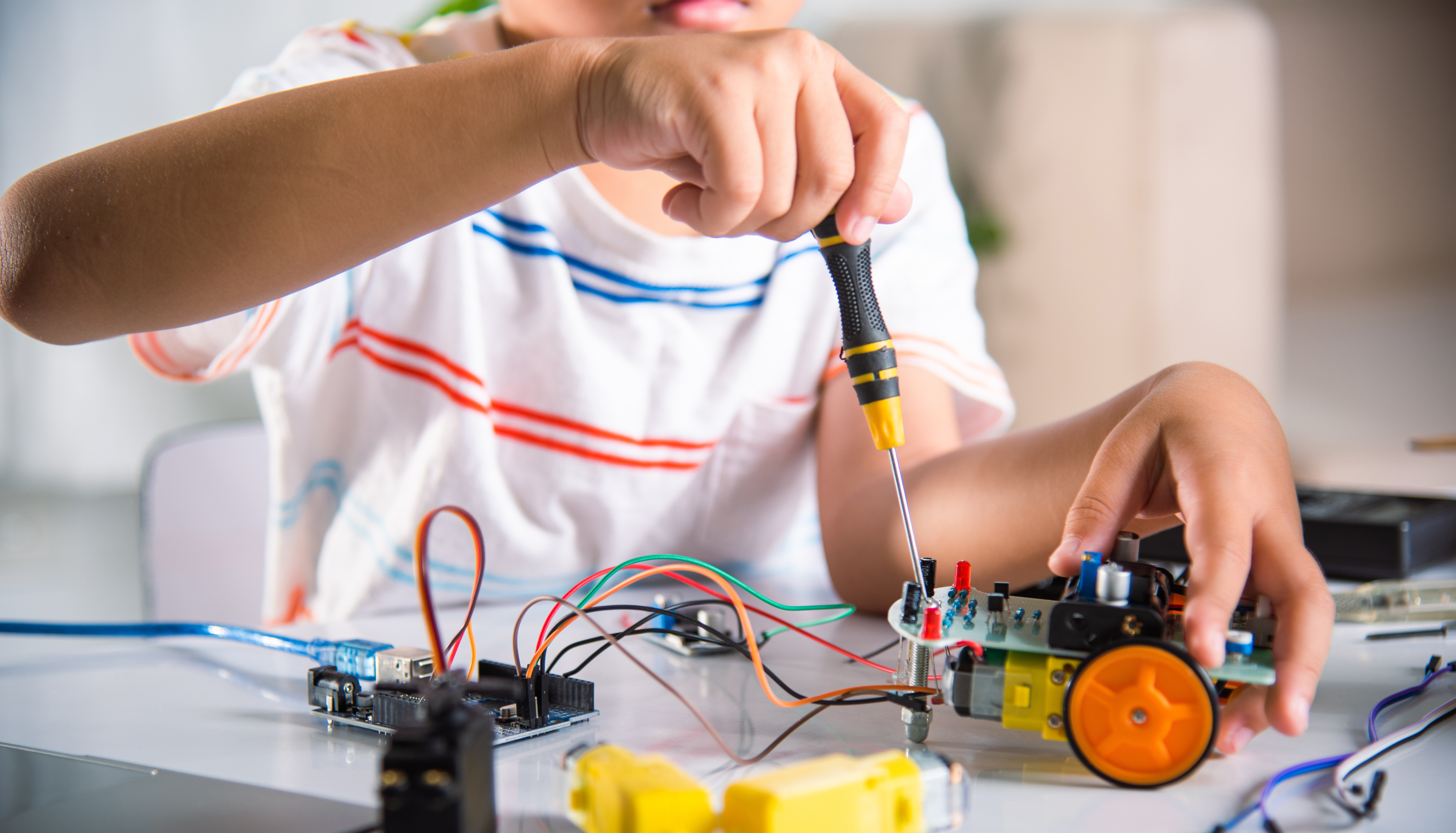 Child working with robotics