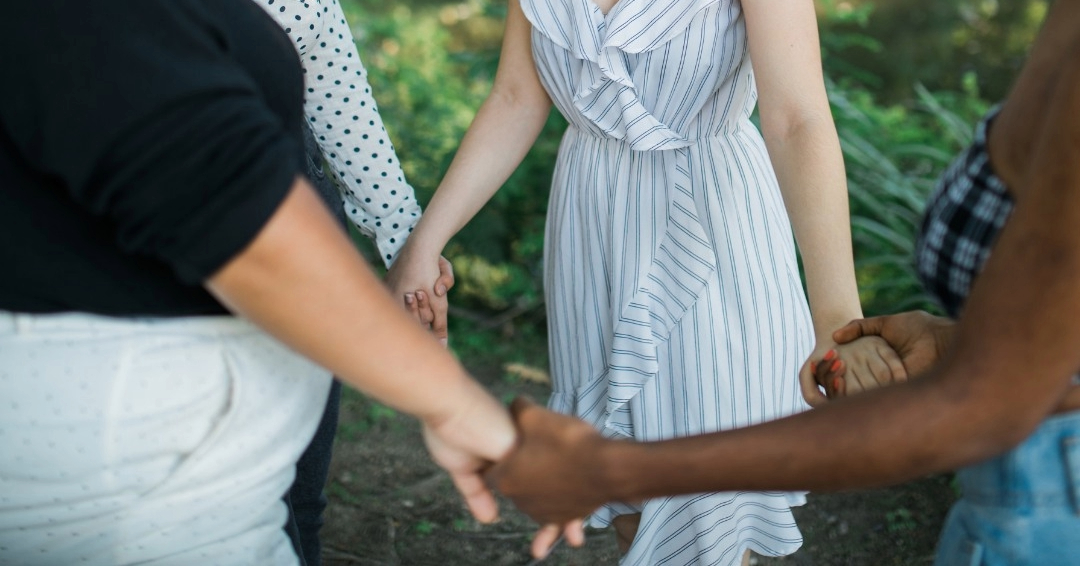 Women holding Hands in a circle: Bridges Domestic Violence Center in Franklin, TN.