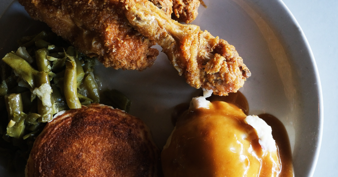 A meal consisting of fried chicken, green beans, mashed potatoes, and gravy at Fox & Locke in Leiper's Fork, TN.