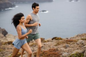 Vuori store in Franklin, Tenn., a woman and a man running wearing Vuori clothing, shoes and accessories.