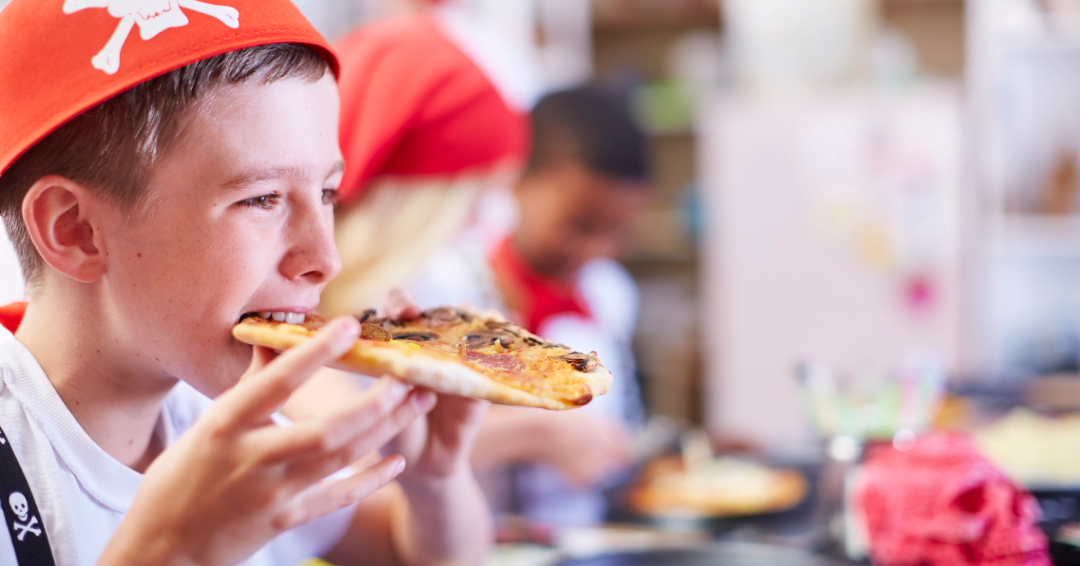 Boy eating pizza in Franklin Tn