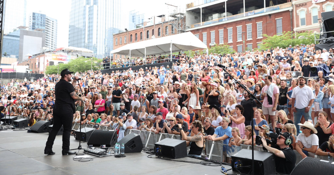 CMA Fest in downtown Nashville, Tennessee, a live music performance and a crowd enjoying live entertainment.