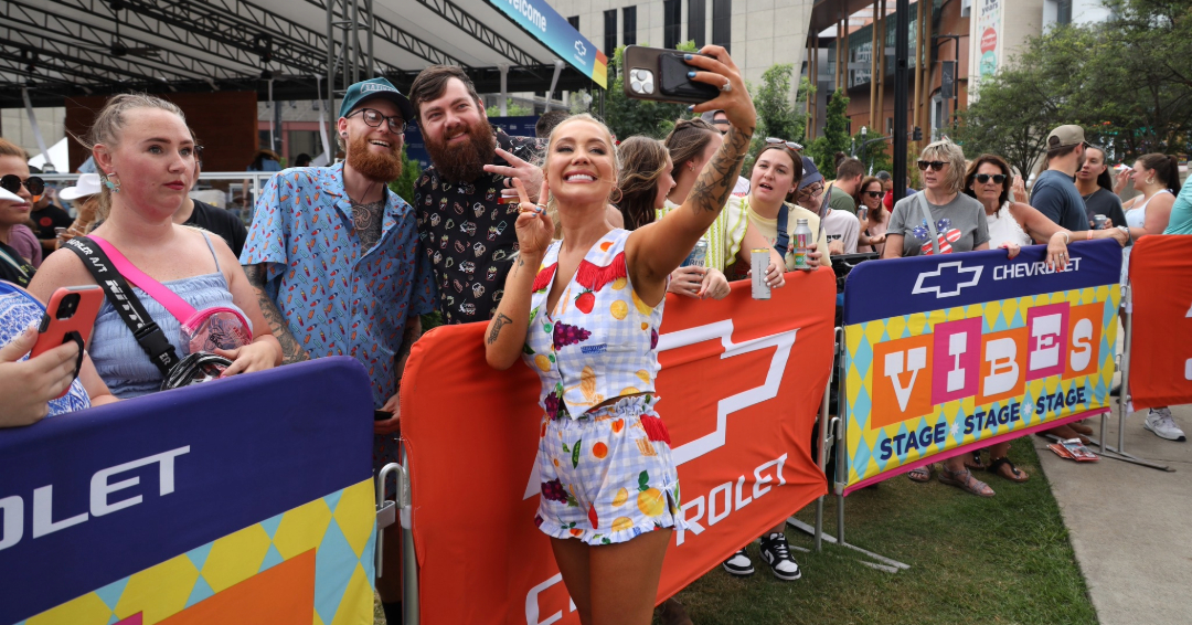 CMA Fest in Nashville, Tenn., performers take pictures with the crowd.