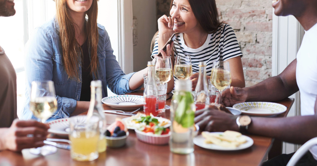 Friends gathering together, enjoying happy hour in Franklin, Tennessee. 