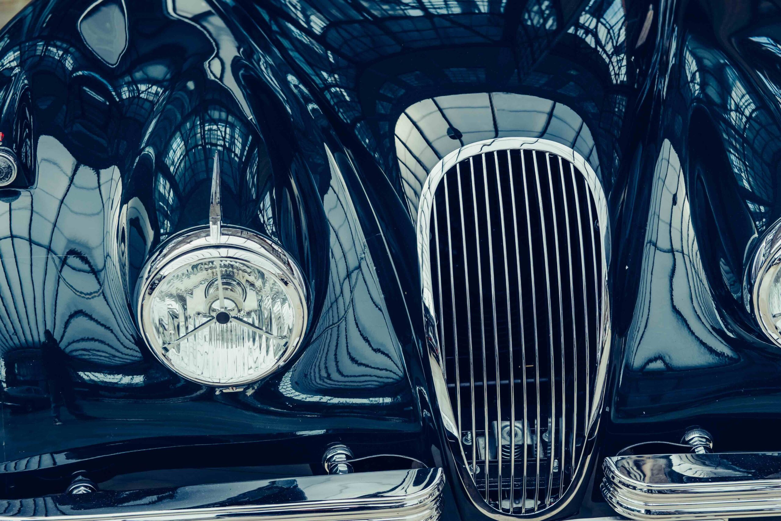 Nashville British Car Club Annual-Car Show in Brentwood, TN, a closeup of the headlights and front bumper on a vintage automobile.