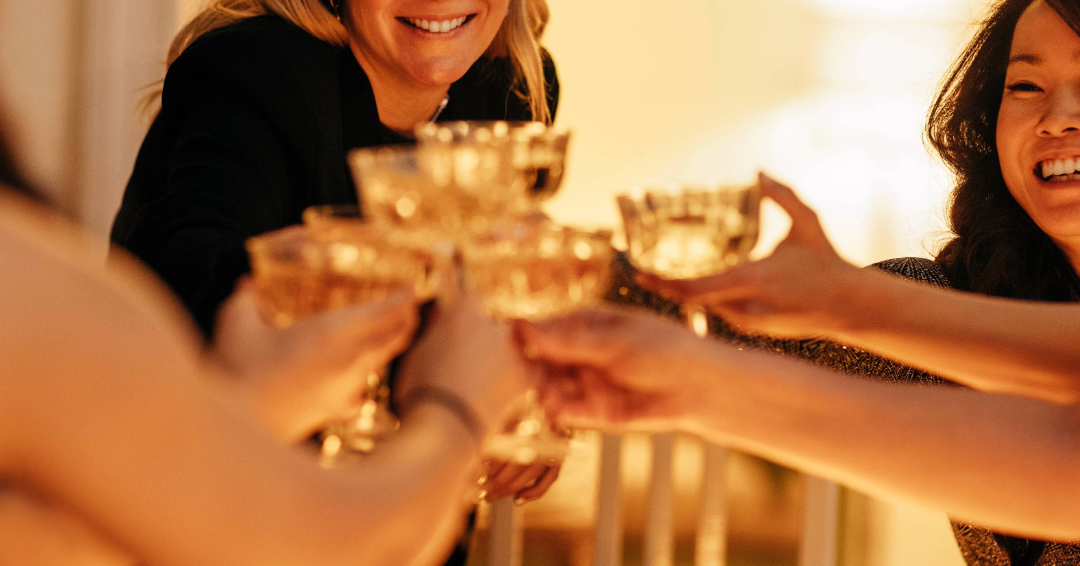 Friends toast champagne, celebrating an engagement in Williamson County, Tennessee. 