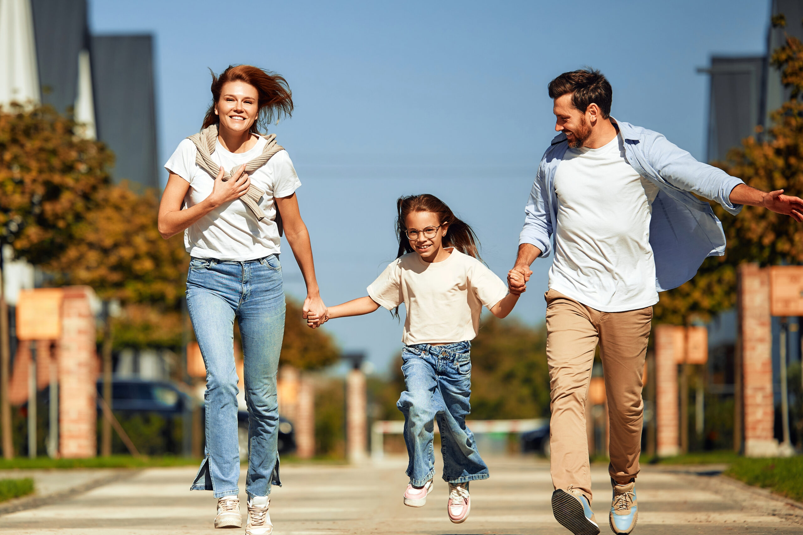 Happy family playing in the street